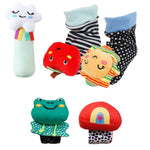 A collection of colorful and whimsical plush toys, including a cloud, an apple, a lion, a frog, and a mushroom, arranged in a playful manner.