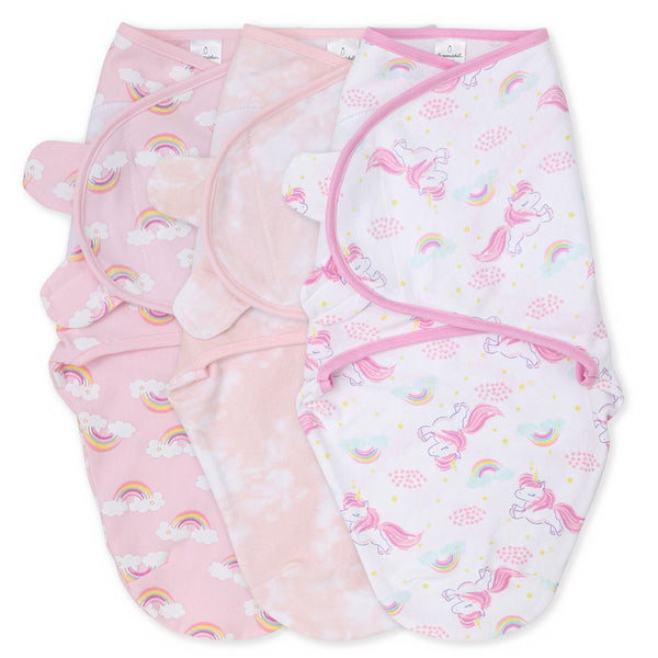 A set of three baby blankets with a unicorn and cloud pattern, in various pastel colors including pink, white, and light pink.